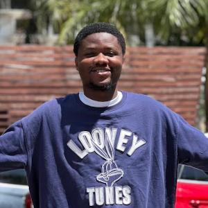 man siles with open arms